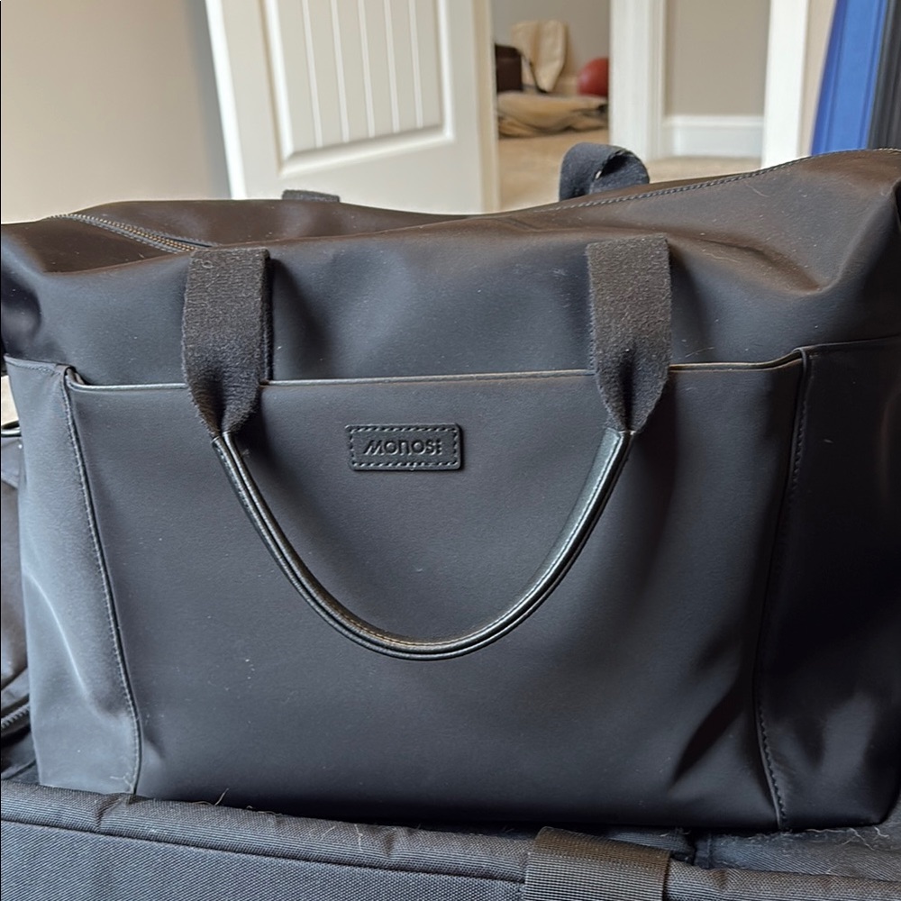 Black Monos Metro Bag with attachable travel pouch